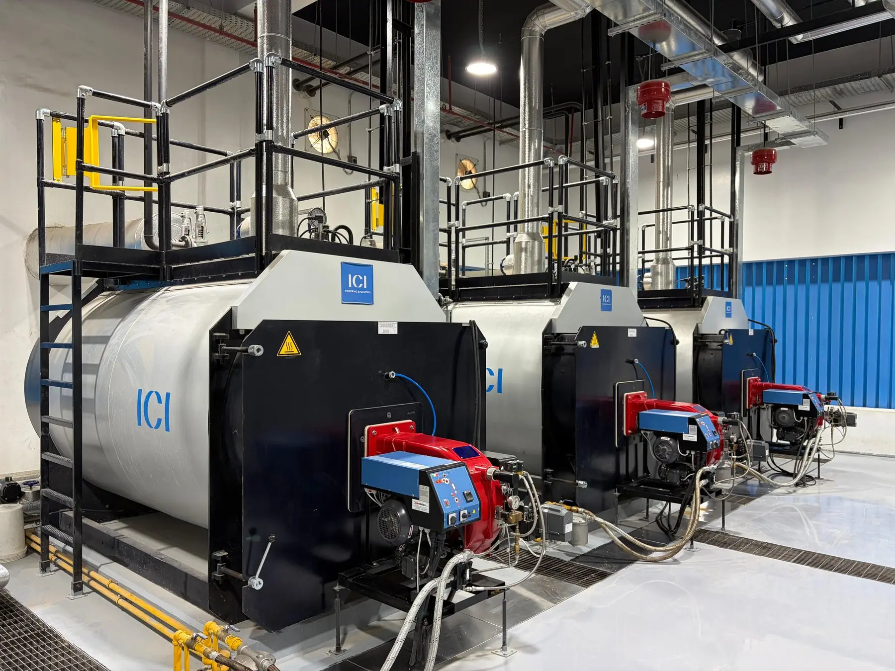 Steam boilers with burners and access platform
